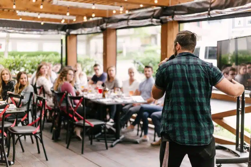 Person speaking in front of a small group