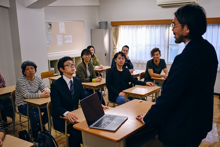 college students attending a class at a public university