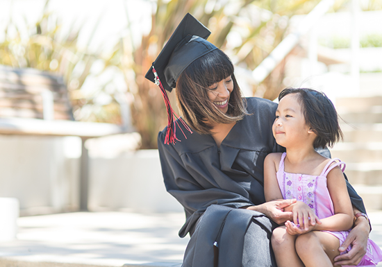 a female graduate celebrating her graduation day with her daughter