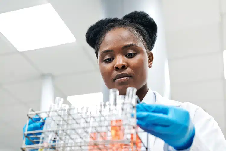 a female epidemiologist working in the lab