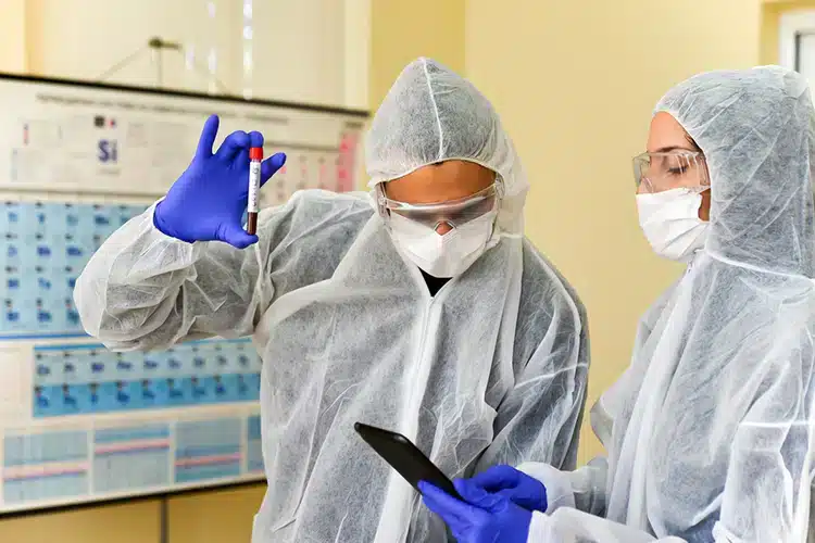 two epidemilogists working together in the lab