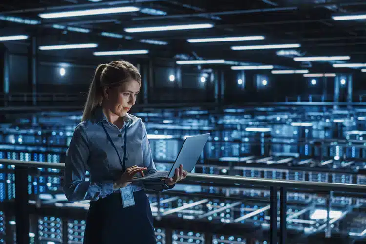 a female IT programmer working on her laptop