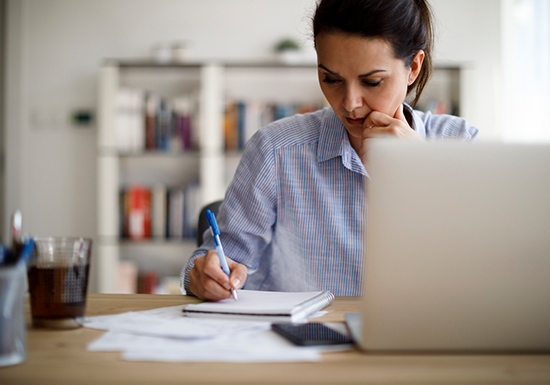 a female academic writer analyzing her primary and secondary research sources