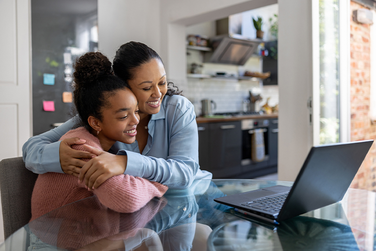 a mom celebrating her young daughter's admission into an online American university