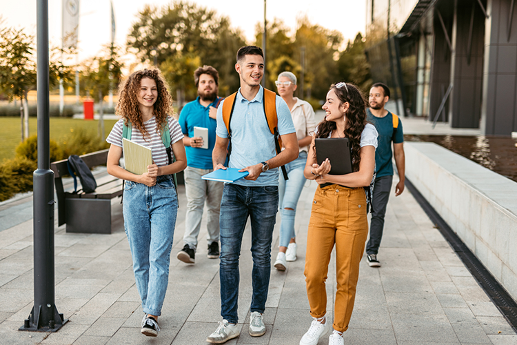 a group of bachelor's degree students taking a walk together