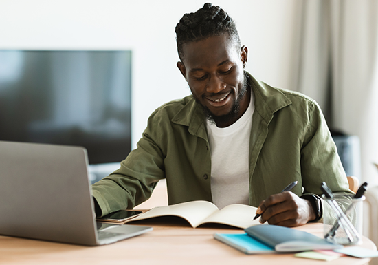 a male online master's degree student prepping for a test