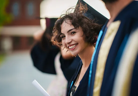 a female college student in her graduation outfit